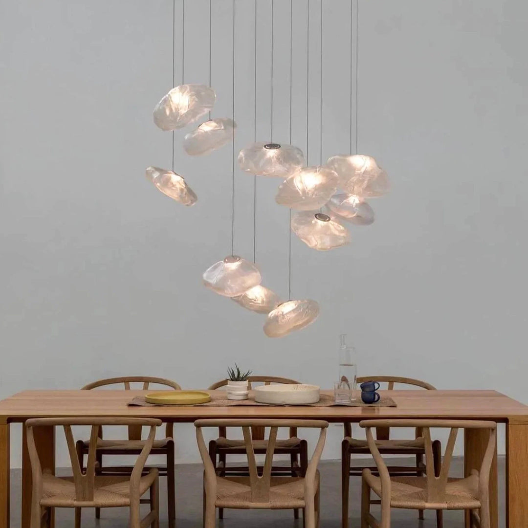 Amber_Halo_Glass_Pendant_Lights_in_Minimalist_Dining_Space_Woorglamp