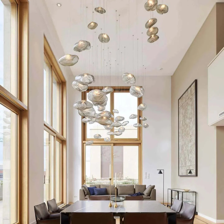 Clear_Halo_Glass_Pendant_Lights_in_Tall_Ceiling_Living_Space_Woorglamp