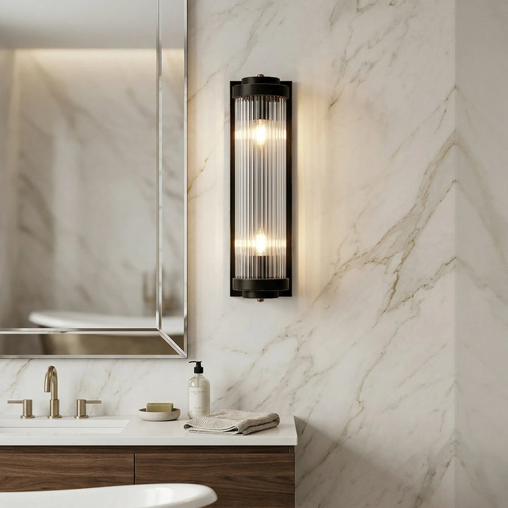 Brass_Vertical_Glass_Wall_Lamp_in_Modern_Bathroom_Woorglamp