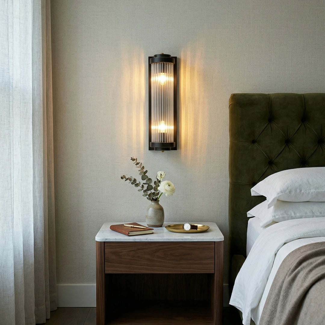 Brass_Vertical_Linear_Wall_Lamp_on_Bedroom_Wall_Woorglamp