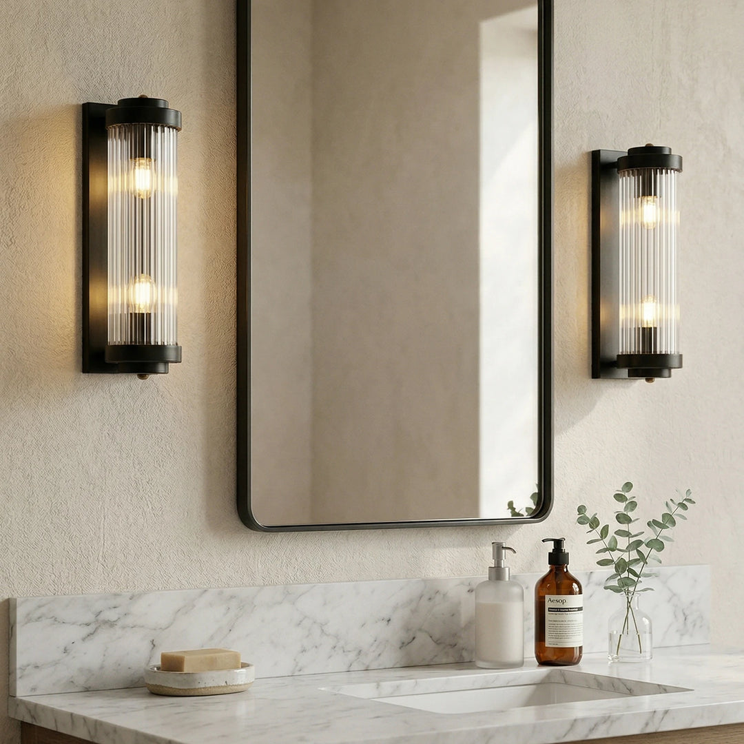 Black_Brass_Vertical_Glass_Wall_Lamp_in_Bathroom_Vanity_Woorglamp