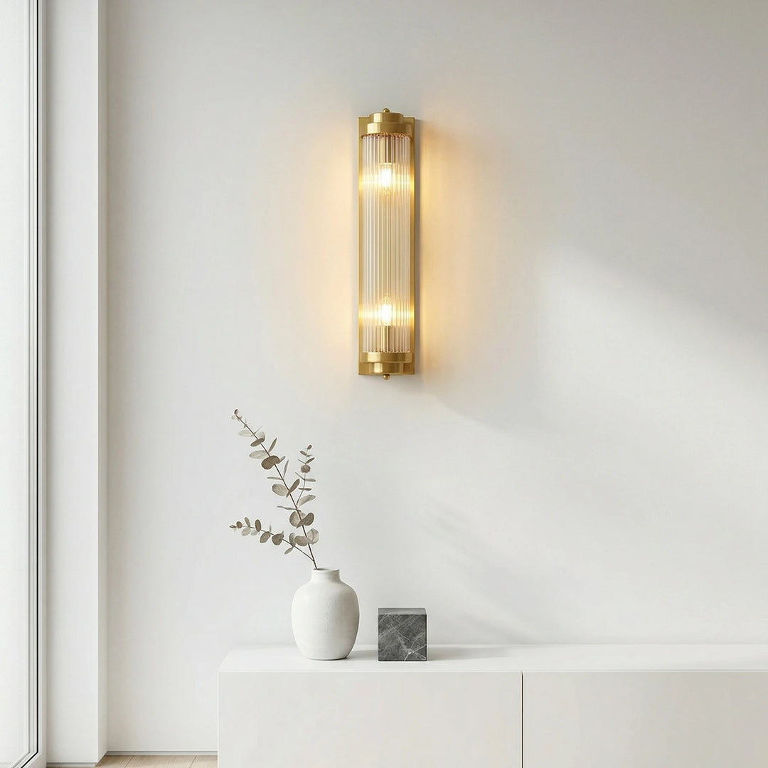 Brass_Vertical_Linear_Wall_Lamp_on_White_Wall_Woorglamp