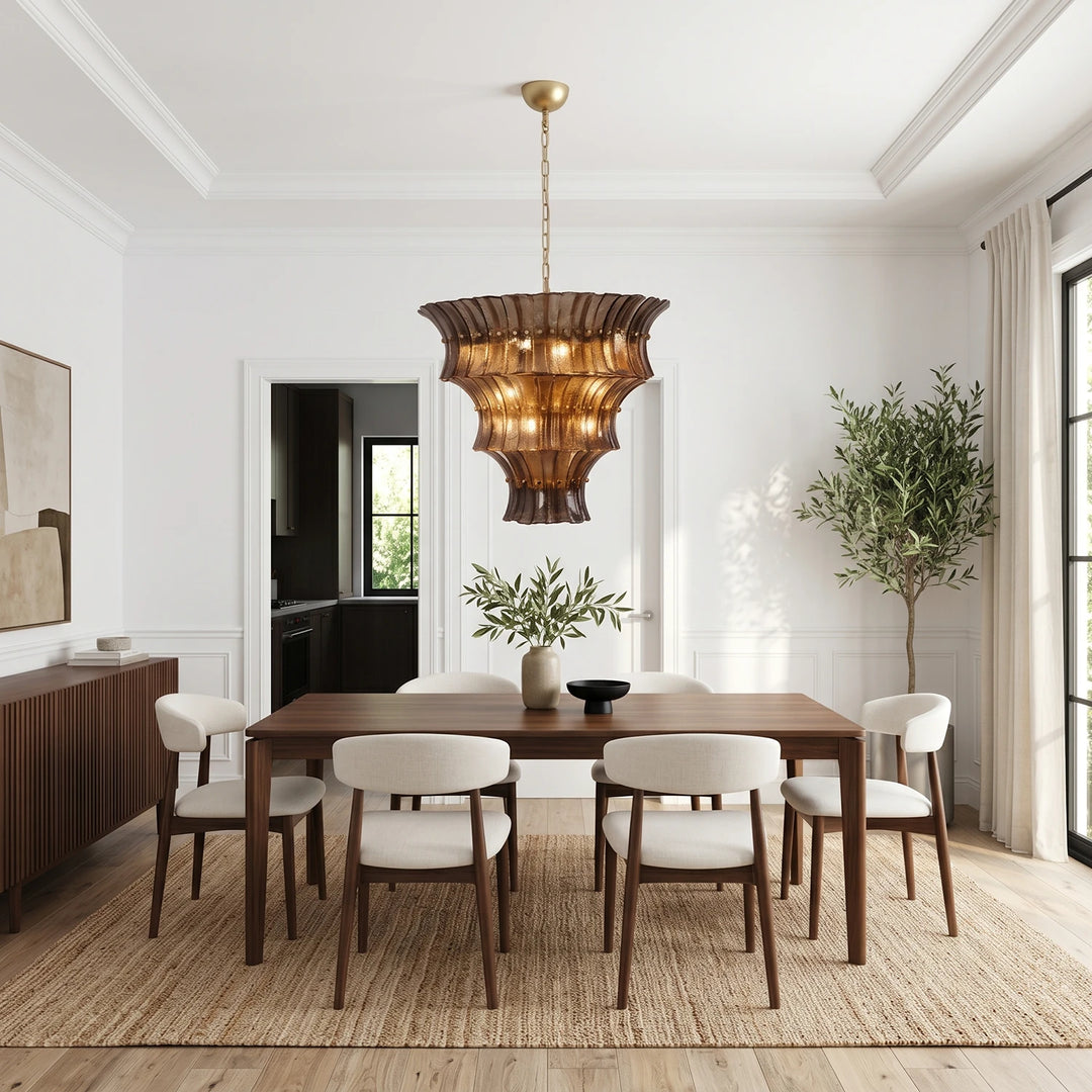 Amber fluted glass chandelier over a long walnut dining table