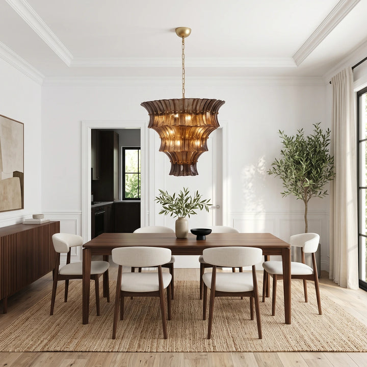 Amber fluted glass chandelier over a long walnut dining table