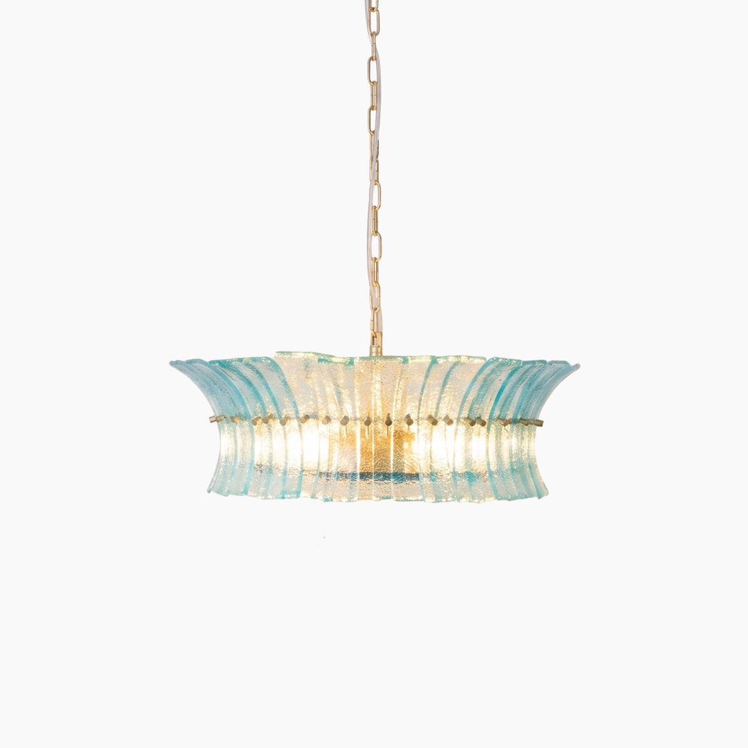 Aqua fluted glass chandelier lit from within, shown at a slight angle