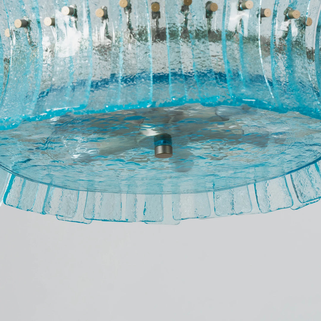 Underside of the aqua glass shade showing how the fluted panels overlap