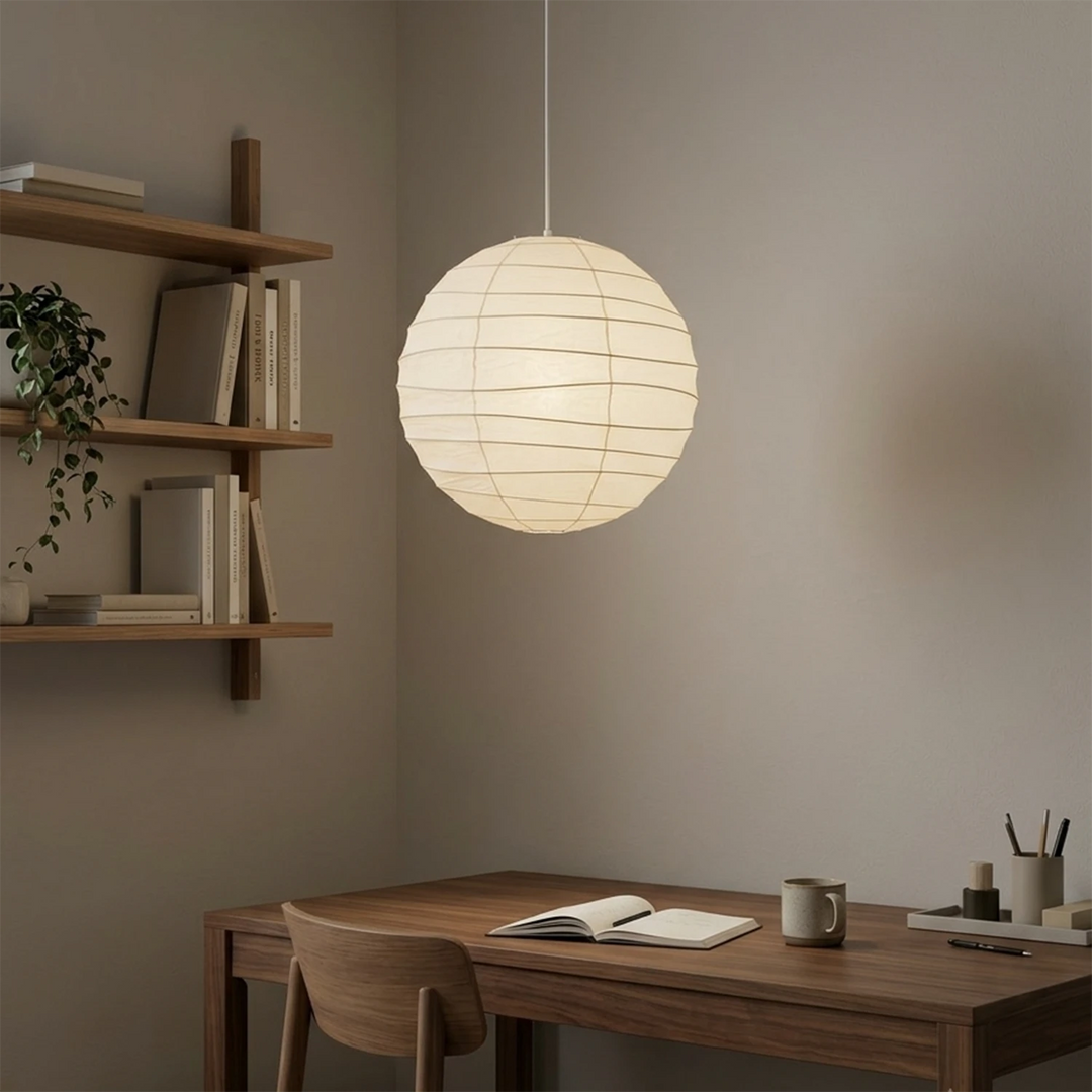 Paper lantern light hanging above a small wooden breakfast table
