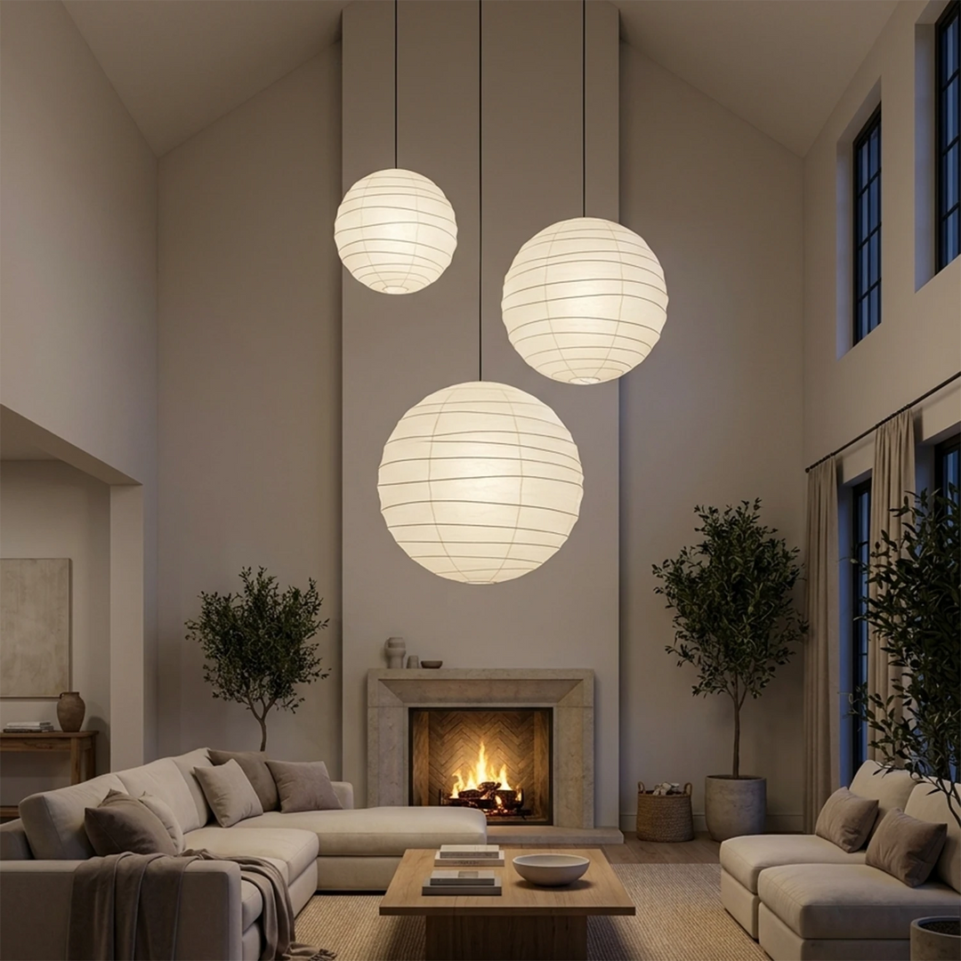 A cluster of paper pendants hung at staggered heights in a tall living room