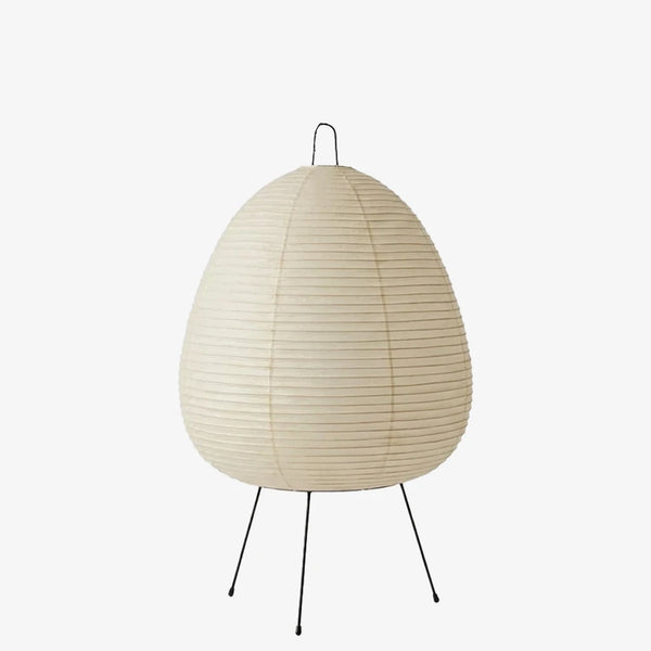Egg-shaped mulberry paper table lamp shown unlit with a tripod base on a soft grey background