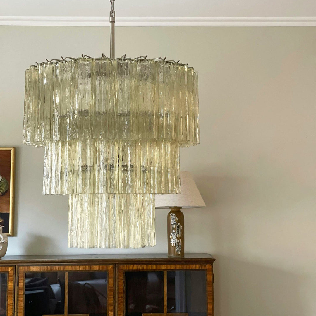 Fantastic Murano Tubes Chandelier with amber glass in a room with a china cabinet and white table lamp