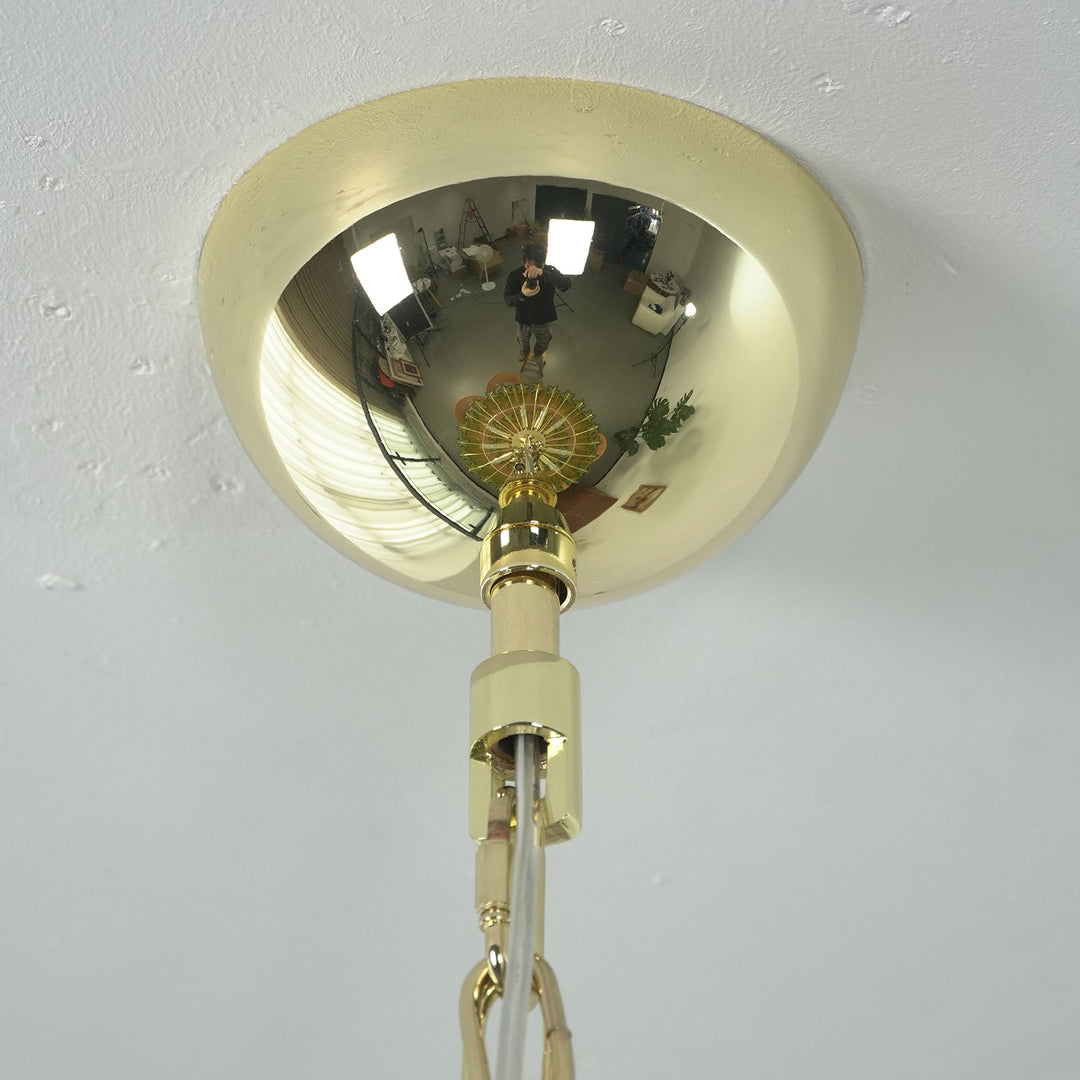 Close-up of brass ceiling mount and hanging chain for the Murano glass chandelier