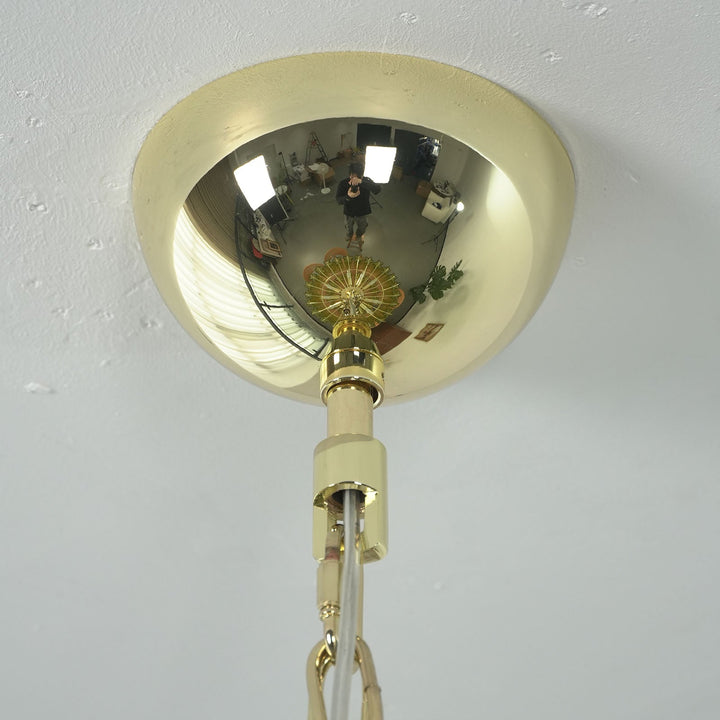 Close-up of brass ceiling mount and hanging chain for the Murano glass chandelier