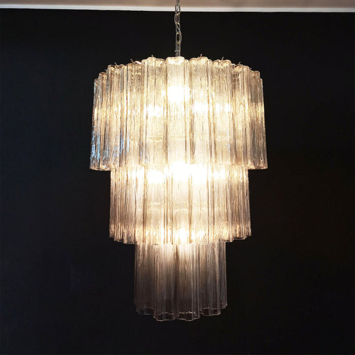 Fantastic Murano Tubes Chandelier with clear glass in a dark corner with a leather chair