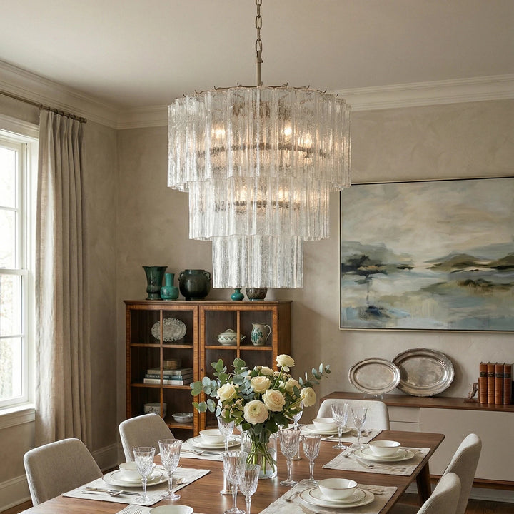Fantastic Murano Tubes Chandelier with clear glass above a bright dining table with floral decor