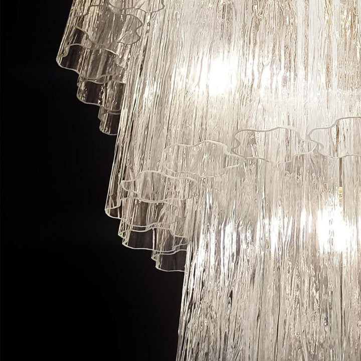Lit Fantastic Murano Tubes Chandelier with clear glass in a dark corner view