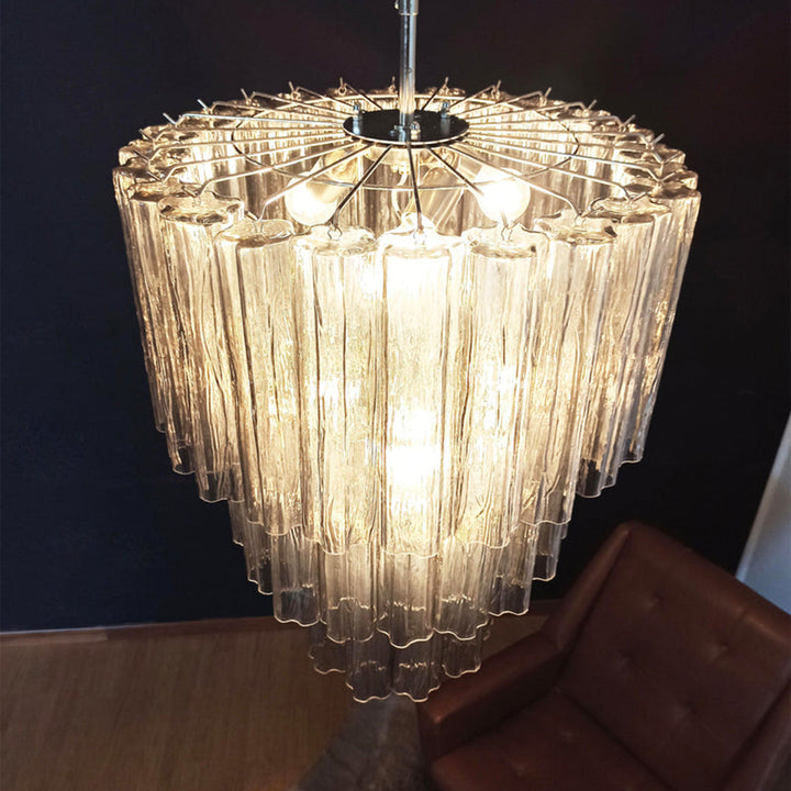 chandelier-clear-lit-corner-view-woorglamp	Lit Fantastic Murano Tubes Chandelier with clear glass in a dark corner view