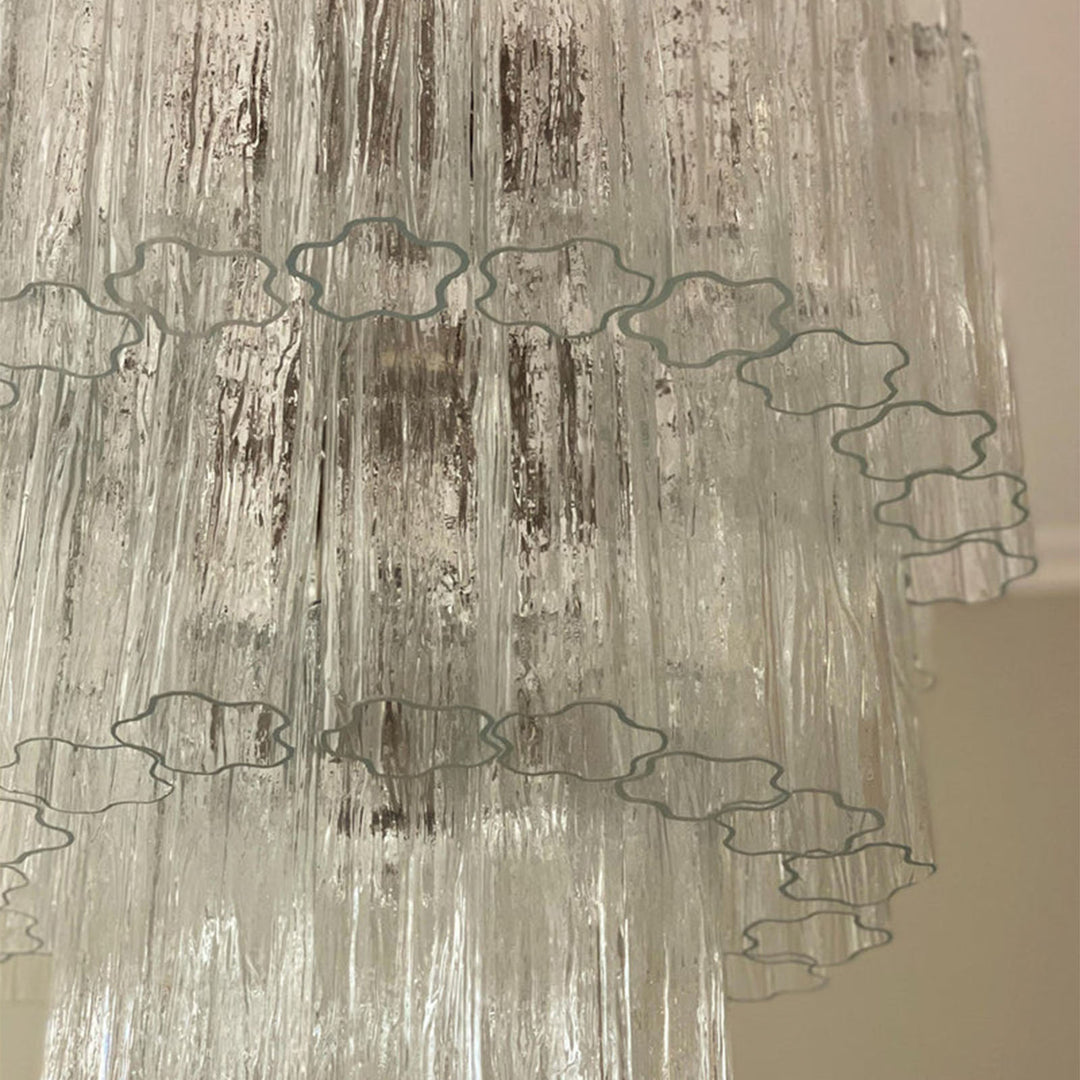 Close-up of rippled texture and star-shaped edges on clear Murano glass tubes