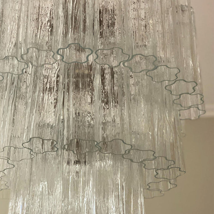 Close-up of rippled texture and star-shaped edges on clear Murano glass tubes