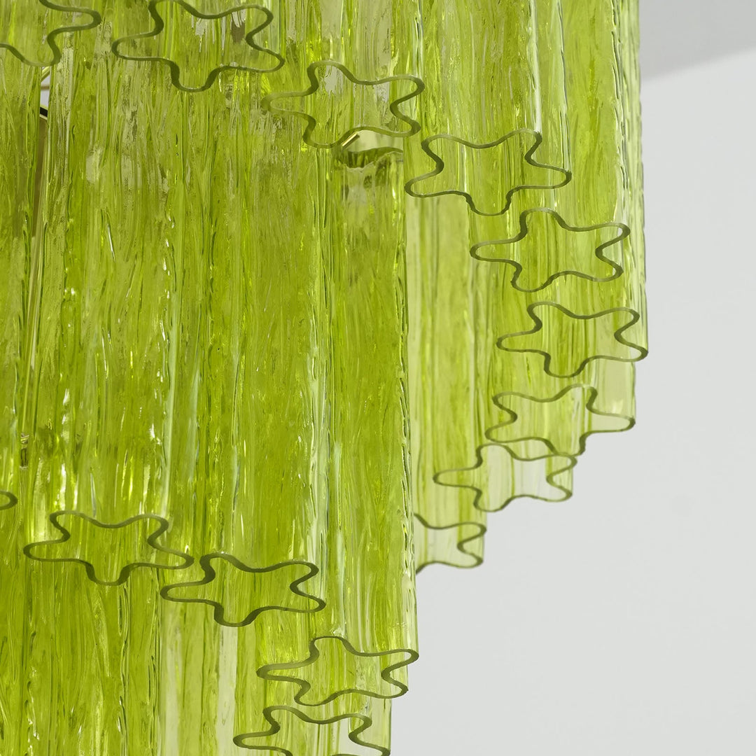 Close-up of rippled texture and star-shaped edges on lime green glass tubes