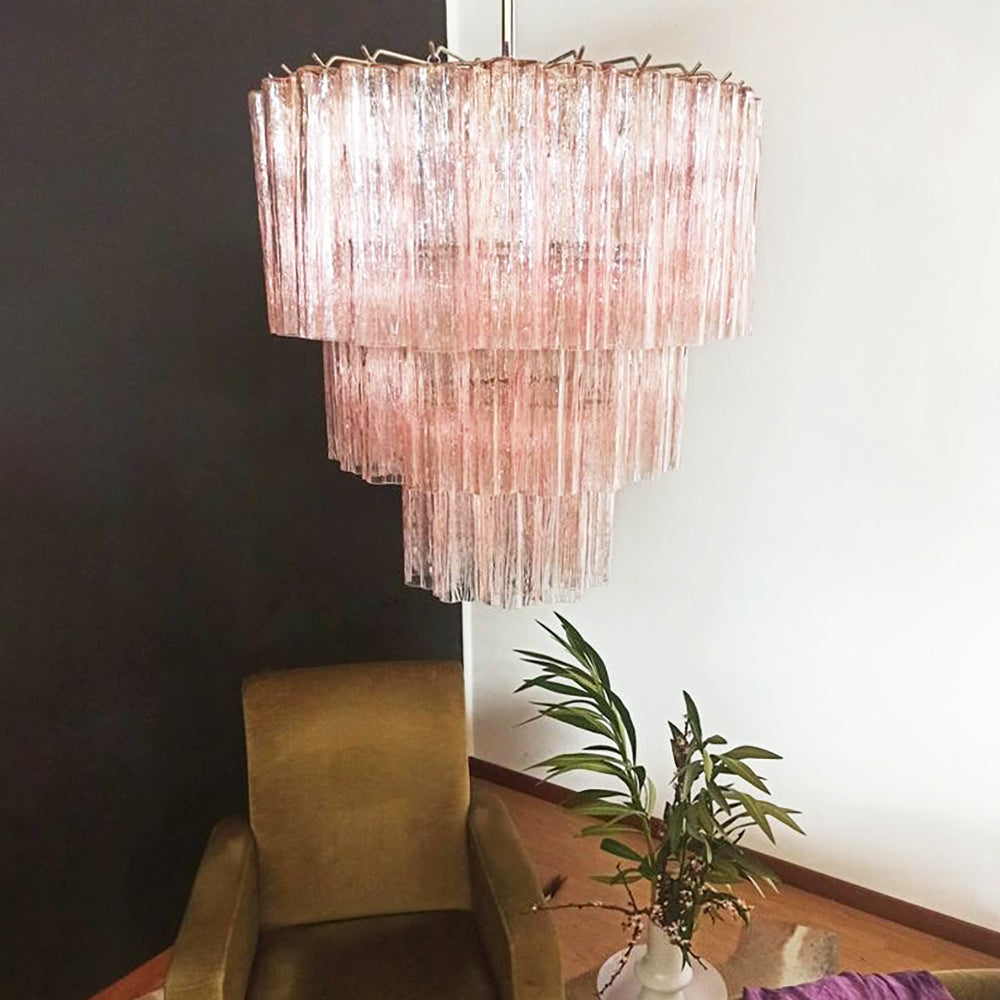 Fantastic Murano Tubes Chandelier with soft pink glass in a dark corner with a brown armchair