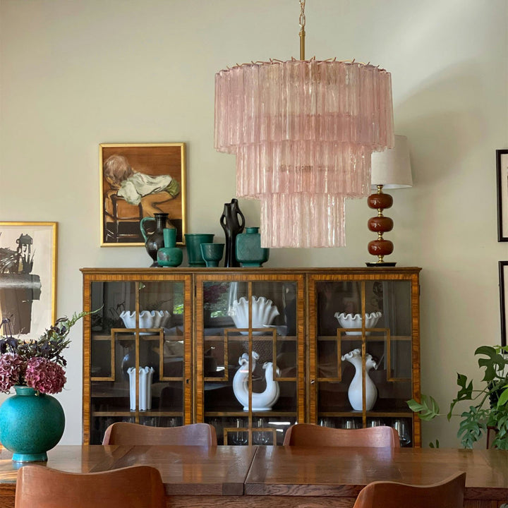 Fantastic Murano Tubes Chandelier with soft pink glass above a wooden dining table with china cabinet