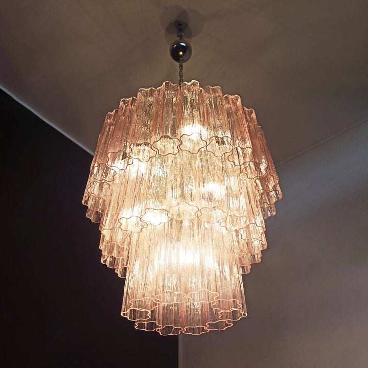 Split view showing pink Murano glass texture, star-shaped edges, and light transmission