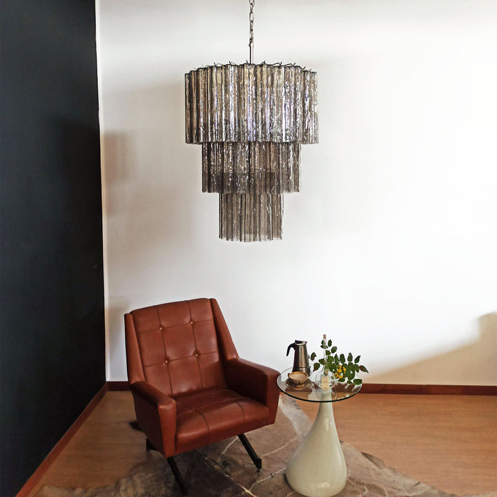 Fantastic Murano Tubes Chandelier with smoke gray glass in a dark corner with a leather chair