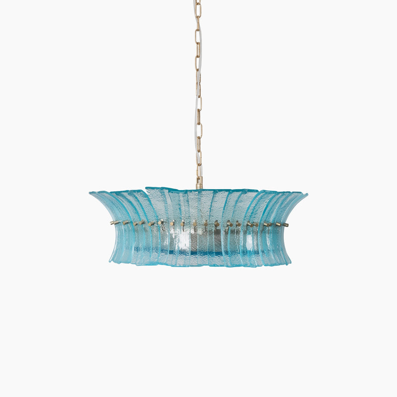 Aqua fluted glass drum chandelier with a brass frame on a light gray background