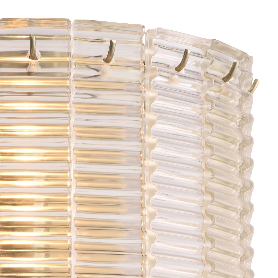 Detail of the frosted glass tiers lit from within with a soft cream glow