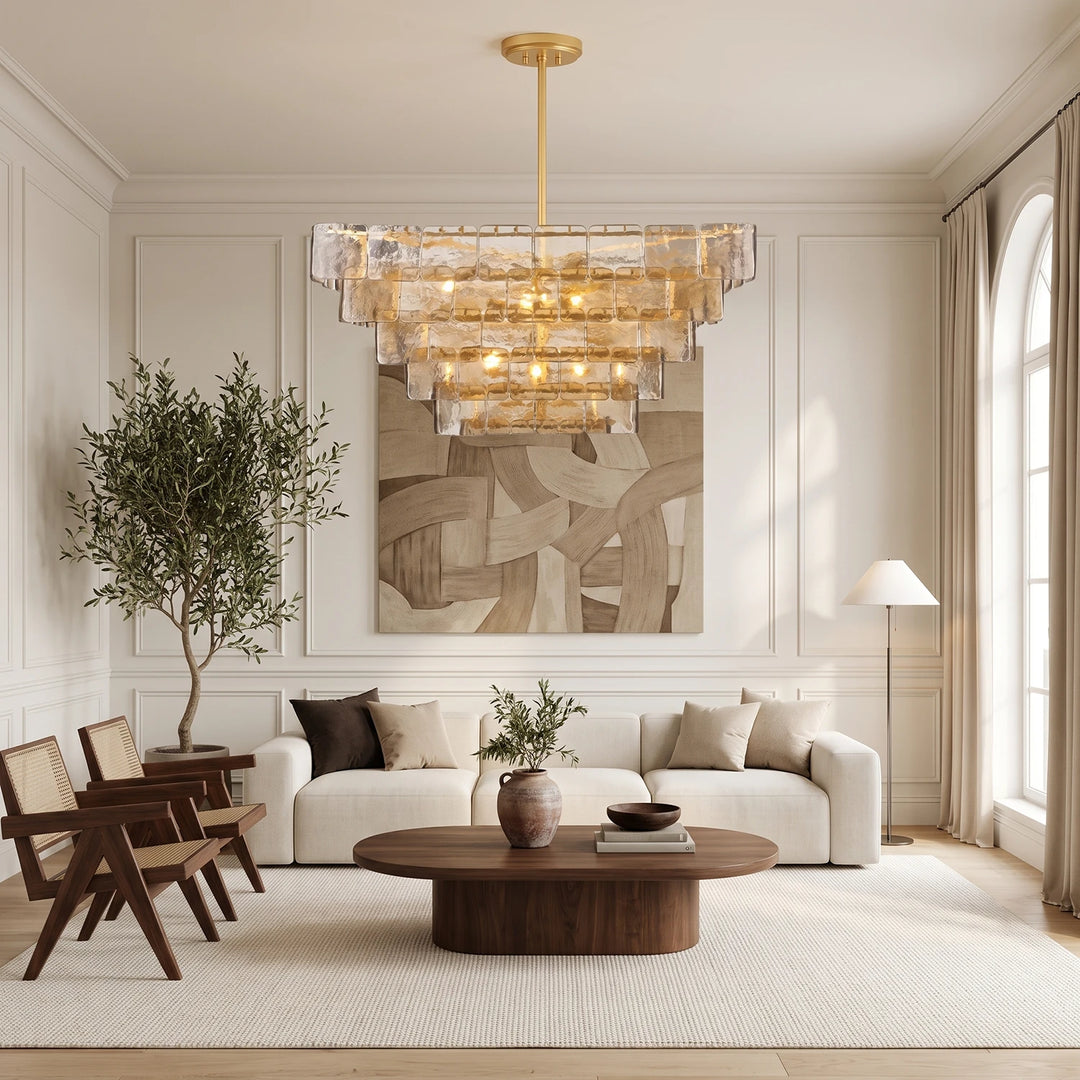 Glass panel chandelier in a neutral living room with a potted olive tree