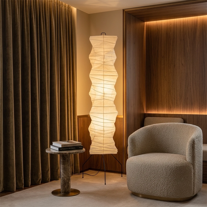 Paper floor lamp lighting a dark corner framed by floor-length curtains