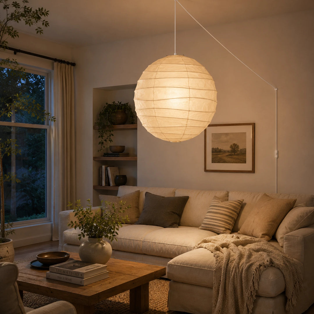 Paper pendant casting warm evening light over a cozy lounge seating area