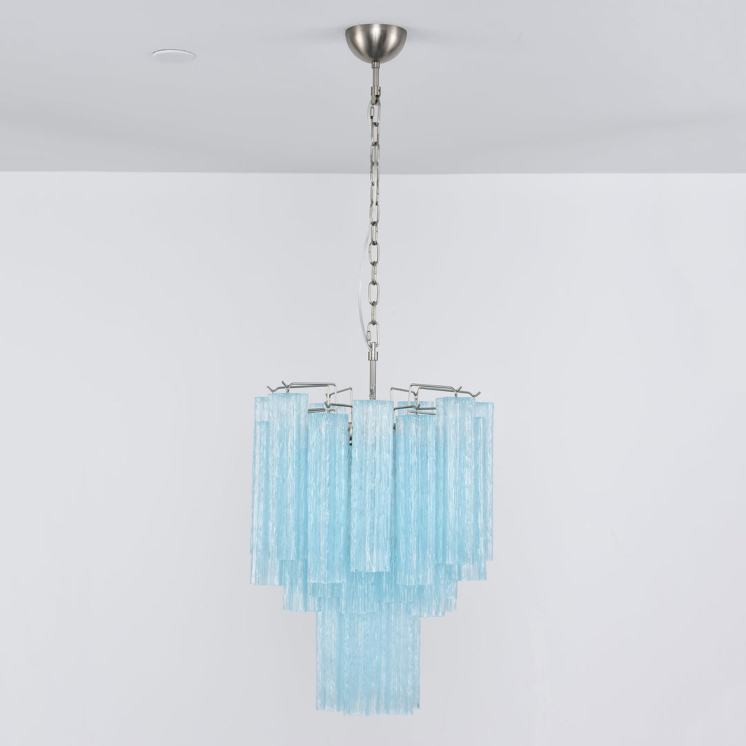 Corner view of Murano Glass Tube Chandelier with amber gold glass tubes on a white wall
