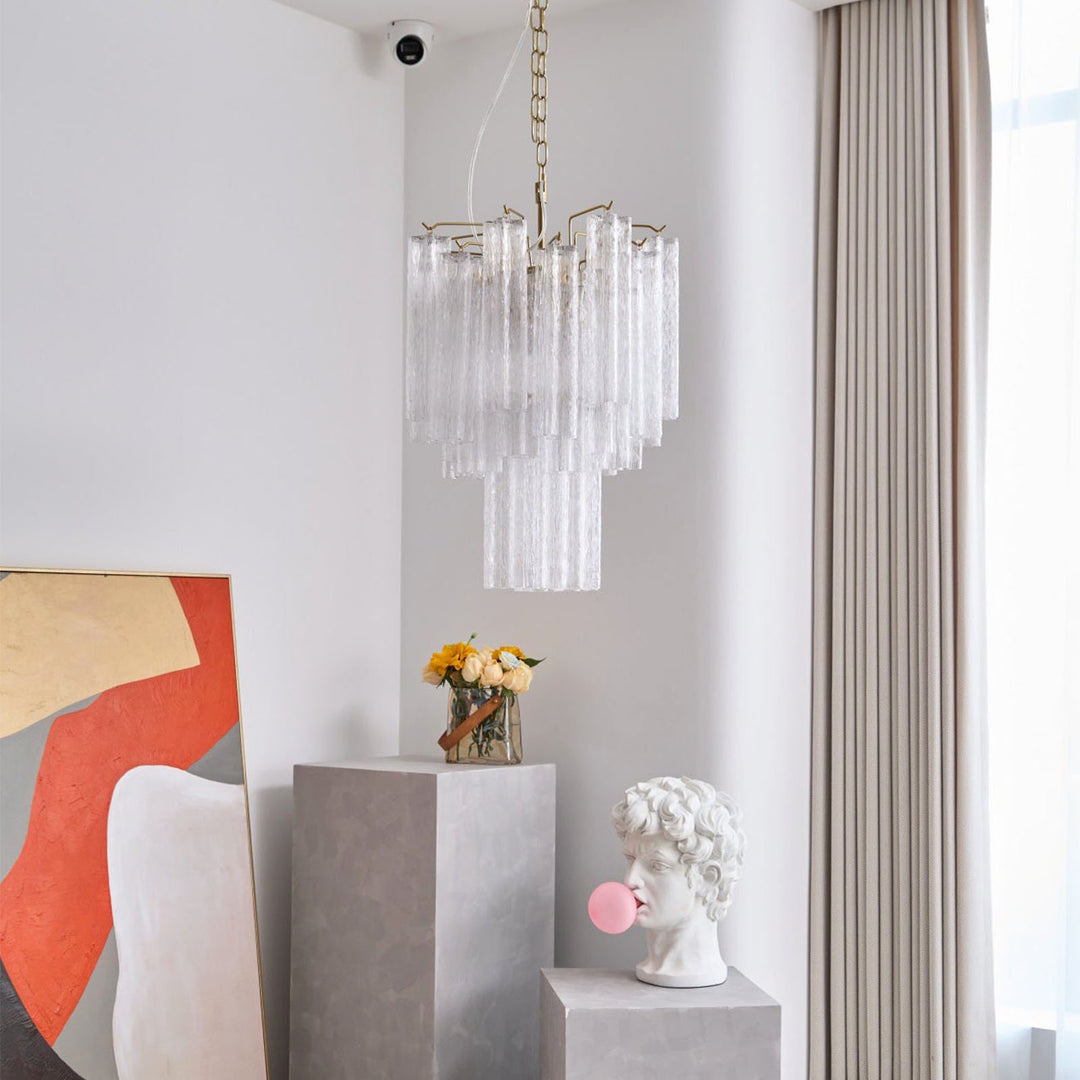 Murano Glass Tube Chandelier with clear glass tubes in a bright room with sheer curtains