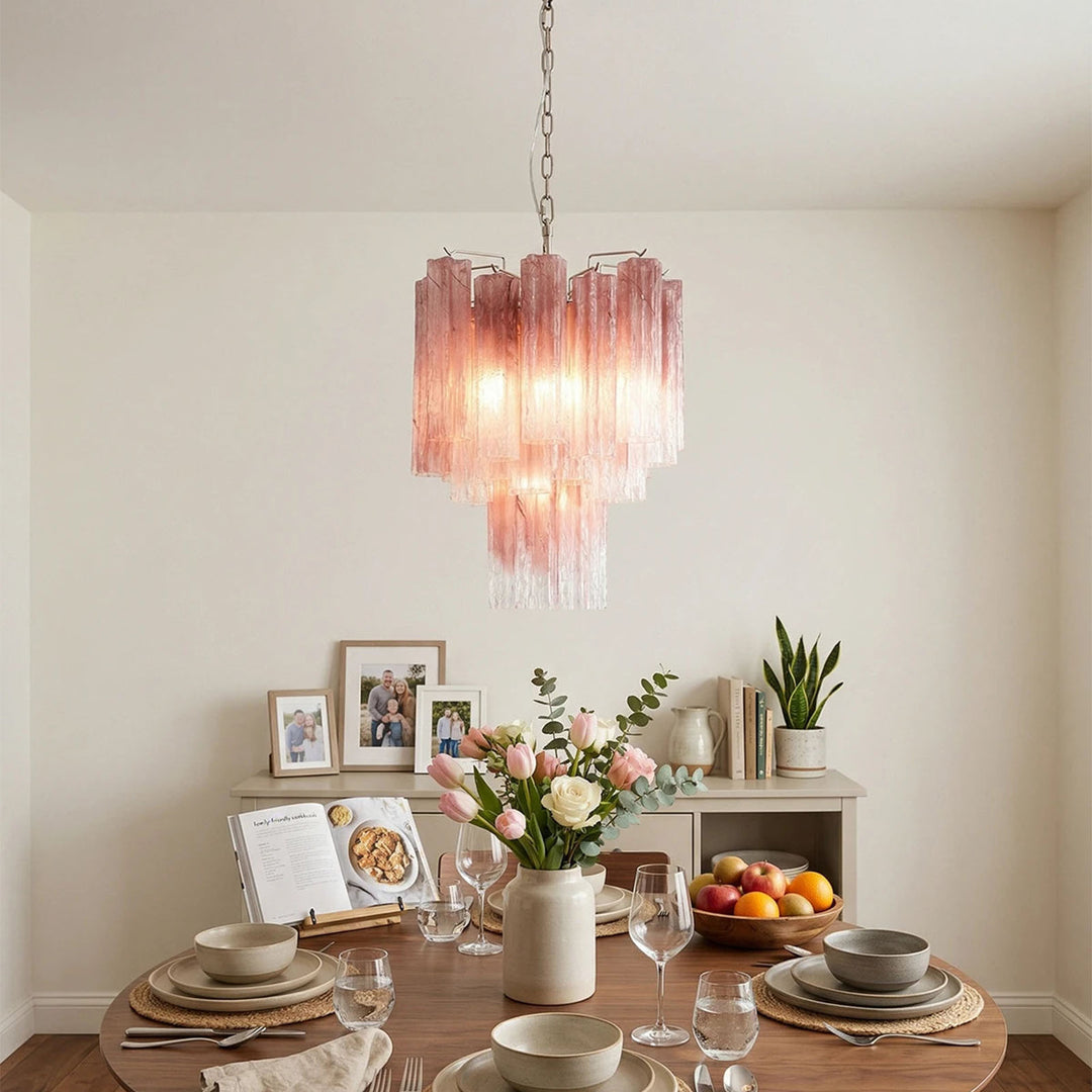 Murano Glass Tube Chandelier with pink gradient glass above a dining table with floral decor