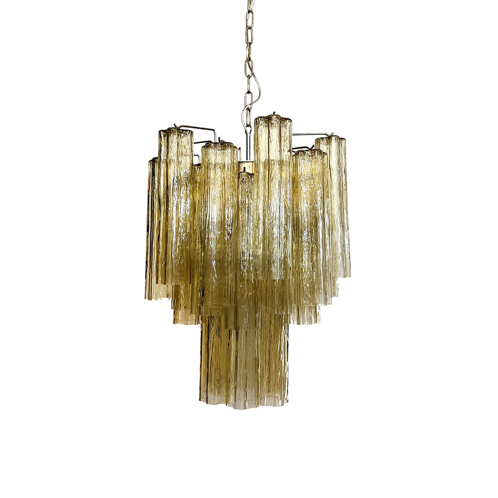 Full view of the lit Murano Glass Tube Chandelier with pink gradient glass tubes on a white ceiling