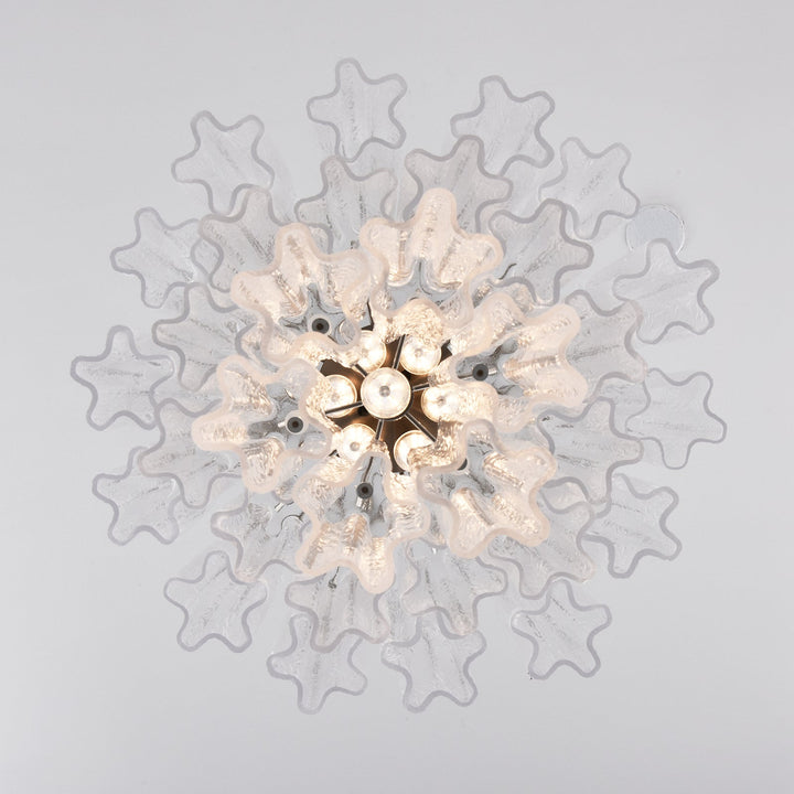 Top view of Murano Glass Tube Chandelier with pink star-shaped glass elements on white background