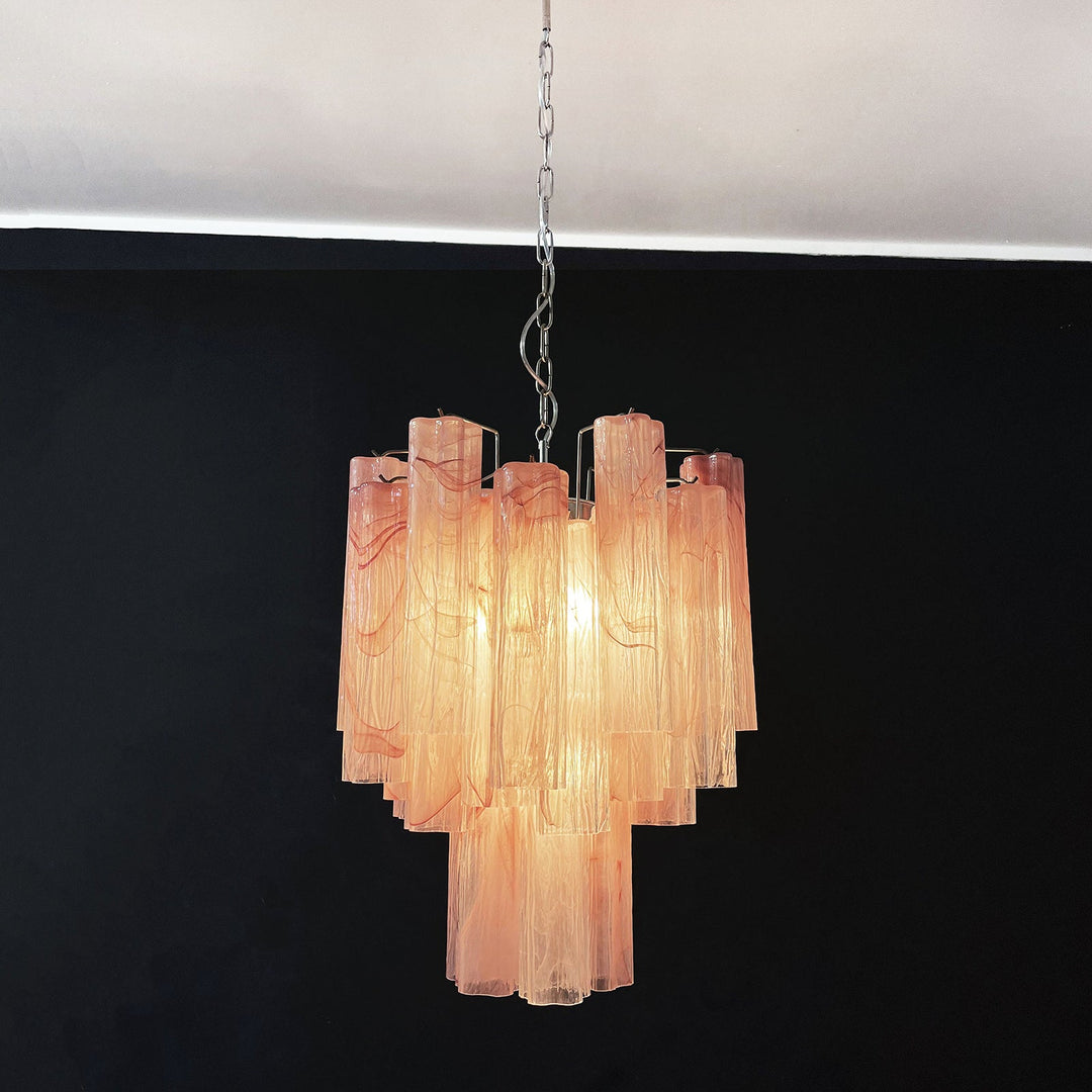 Murano Glass Tube Chandelier with pink gradient glass lit with warm light on a white ceiling