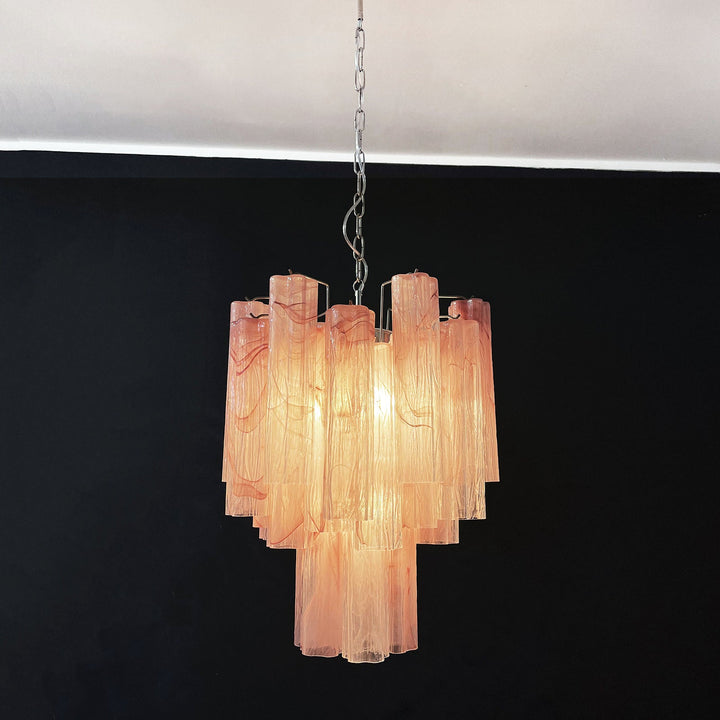 Murano Glass Tube Chandelier with pink gradient glass lit with warm light on a white ceiling