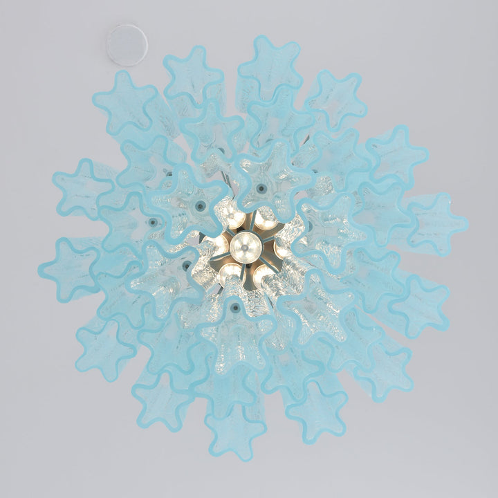 Corner view of Murano Glass Tube Chandelier with turquoise glass tubes on a white wall