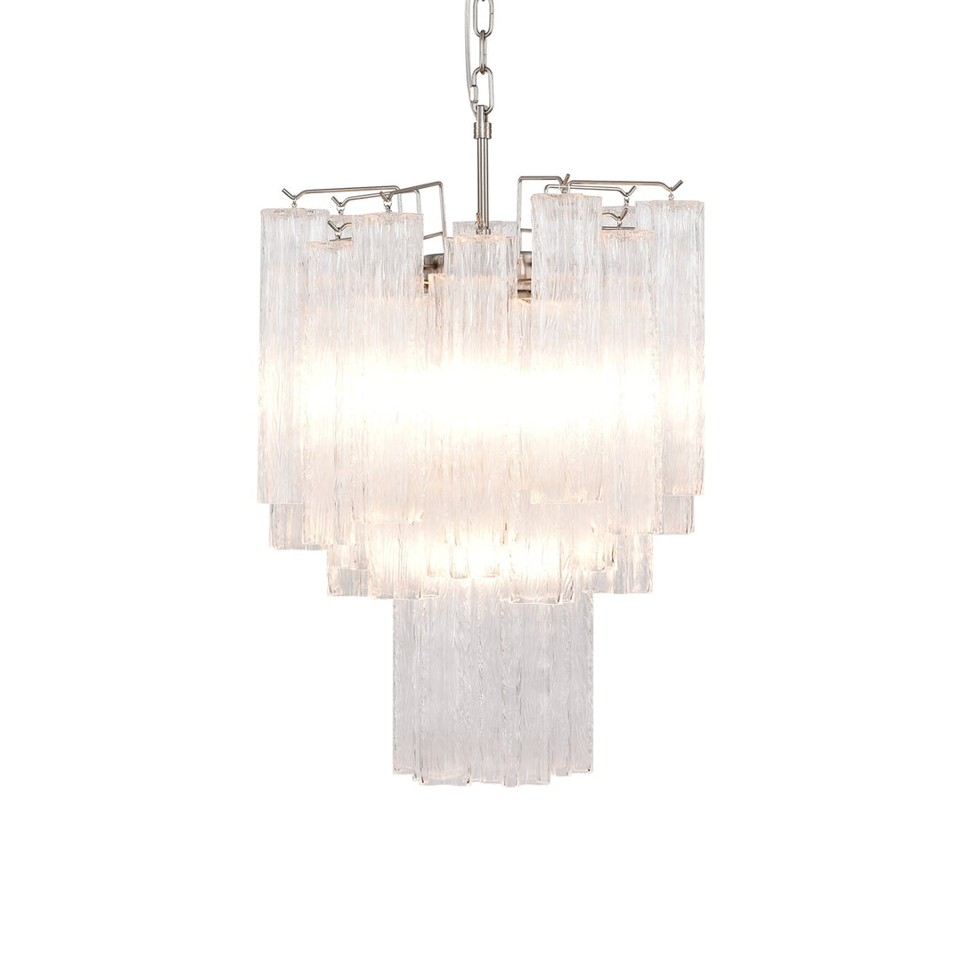 Corner view of the lit Murano Glass Tube Chandelier with turquoise glass tubes on a white wall