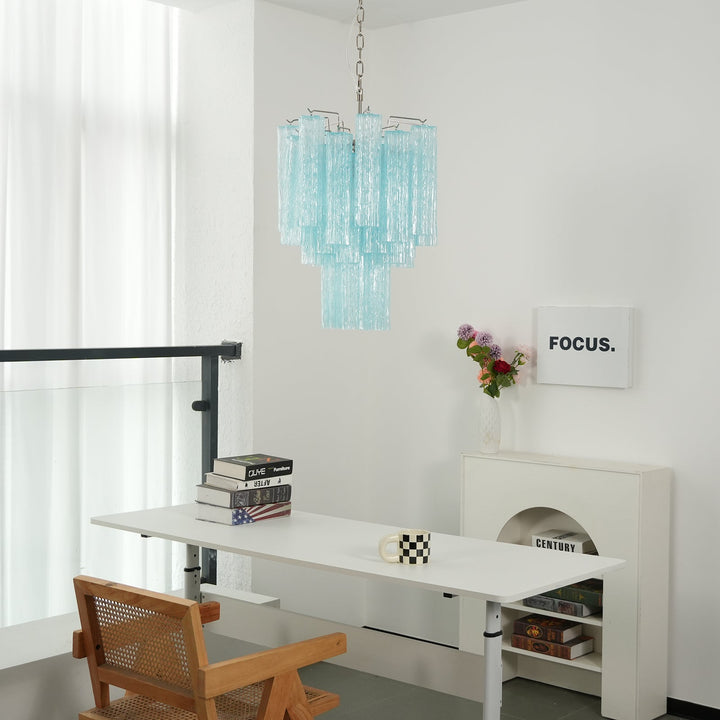 Murano Glass Tube Chandelier with turquoise glass above a desk with minimalist decor