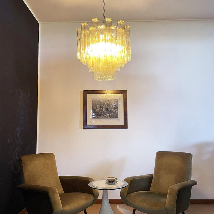 Murano Star Tube Chandelier with amber glass on a plain white wall
