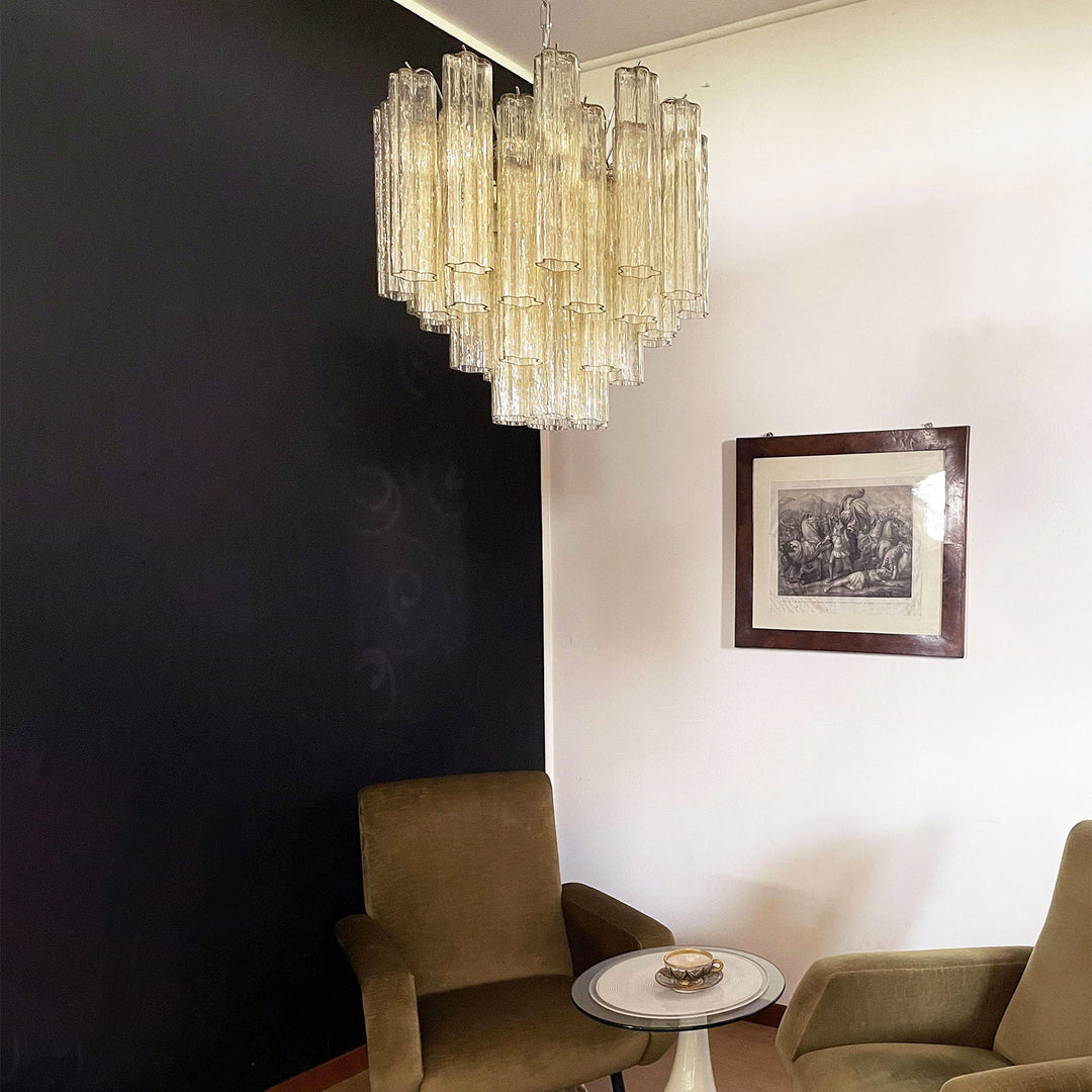 Murano Star Tube Chandelier with amber glass in a room with two green upholstered chairs
