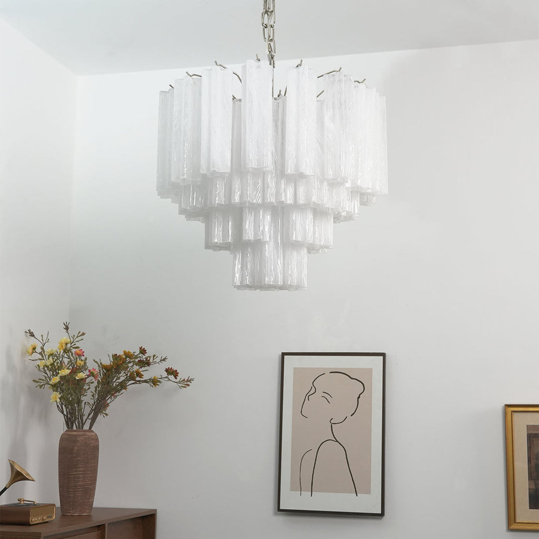 Murano Star Tube Chandelier with clear glass in a minimalist corner with framed line art