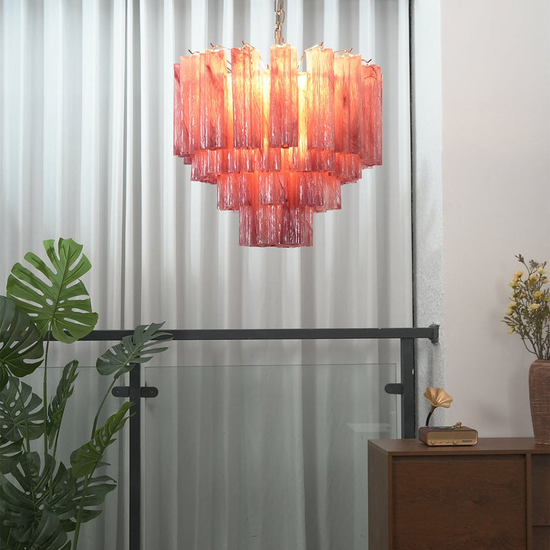 Murano Star Tube Chandelier with pink gradient glass hanging in a bright room with sheer curtains