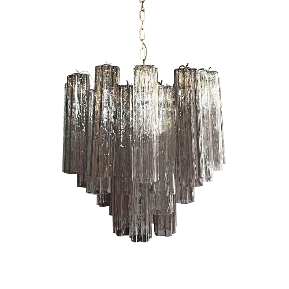 Murano Star Tube Chandelier with vibrant purple glass on a plain white wall