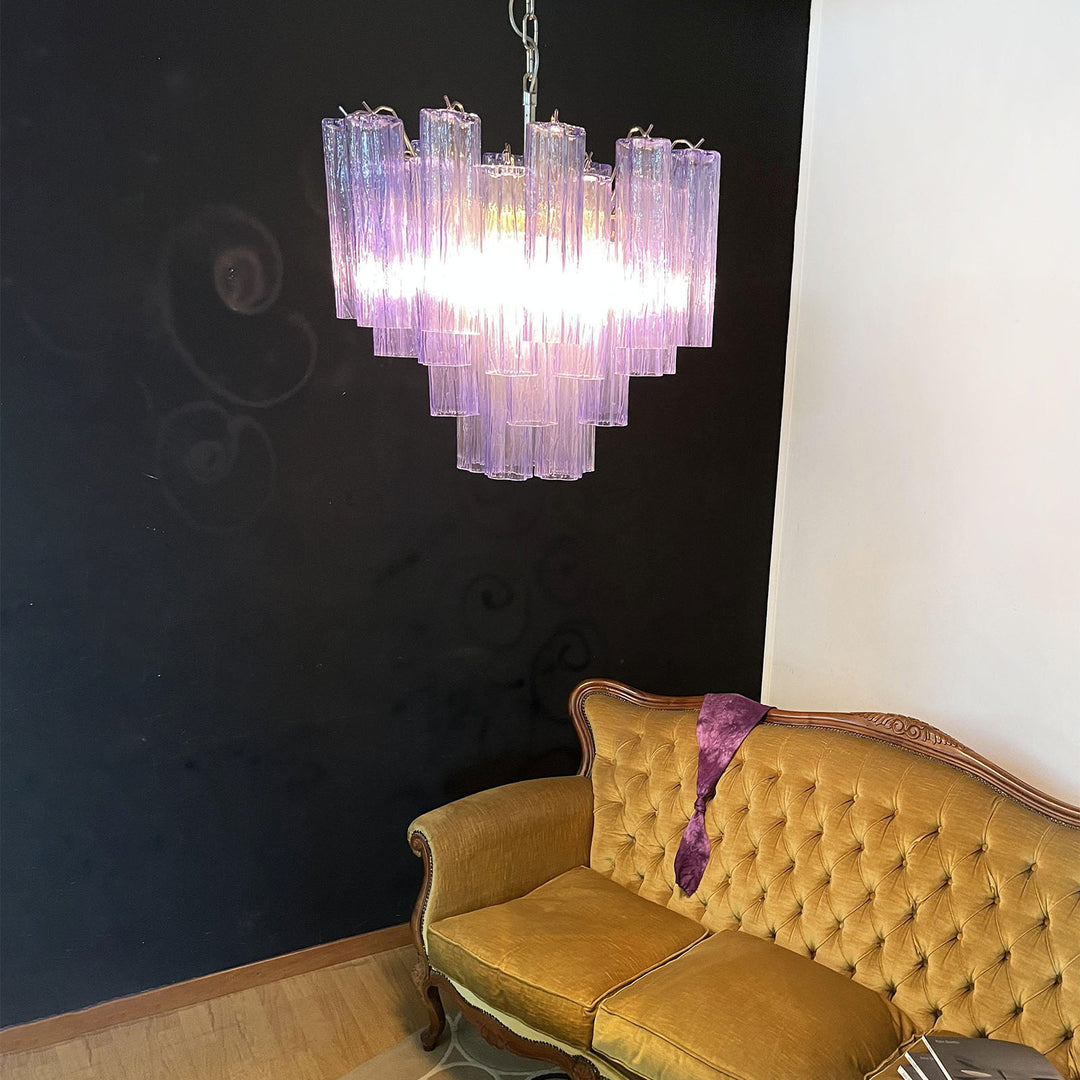Murano Star Tube Chandelier with purple glass above a vintage gold tufted sofa