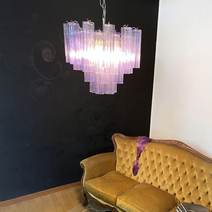 Murano Star Tube Chandelier with purple glass above a vintage gold tufted sofa