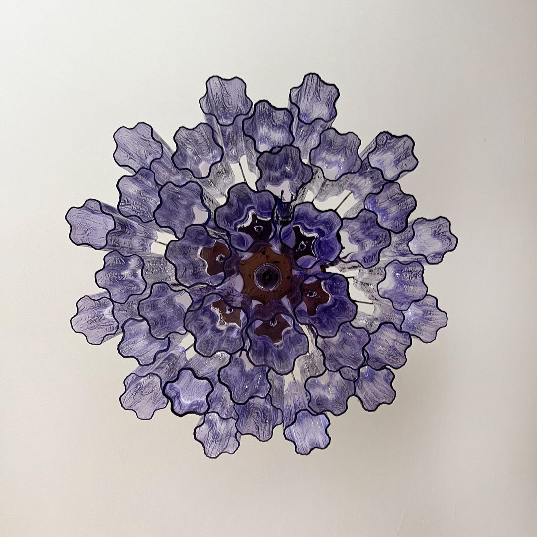 Top view of Murano Star Tube Chandelier with purple star-shaped glass elements on white background